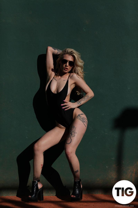 Saskia Valentine Shooting in Her Bodysuot