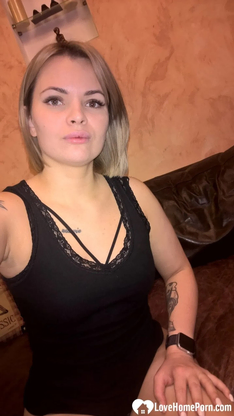 Light-haired honey displays her small bosoms & her sleek-smoothly-shaven cunt in dark-hued lingerie