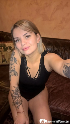 Light-haired honey displays her small bosoms & her sleek-smoothly-shaven cunt in dark-hued lingerie