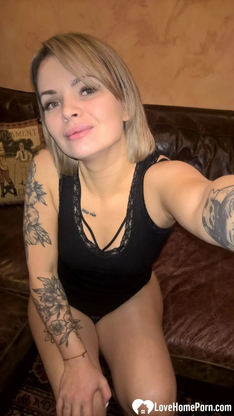 Light-haired honey displays her small bosoms & her sleek-smoothly-shaven cunt in dark-hued lingerie