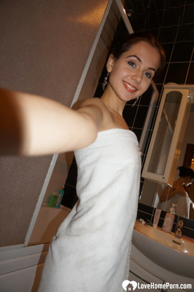 Lovely dark-skinned-haired nerdy teen unsheathes her smallish boobs and smoothly-shaven poon at home