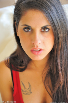 Raven-haired babe Lilly frolicking and opening up her sugary-sweet vagina in a solo