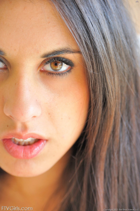 Raven-haired babe Lilly frolicking and opening up her sugary-sweet vagina in a solo