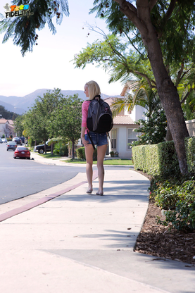 Light-haired teen Sammie Daniels takes a ultra-cute walk after ending her classes
