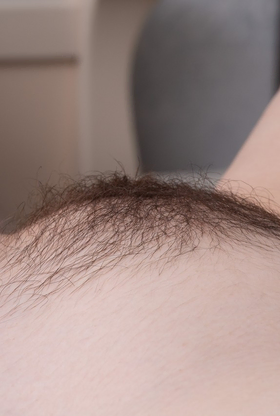 Elegant honey Uli liquidates her dress and lingerie to finger her fur covered honeypot