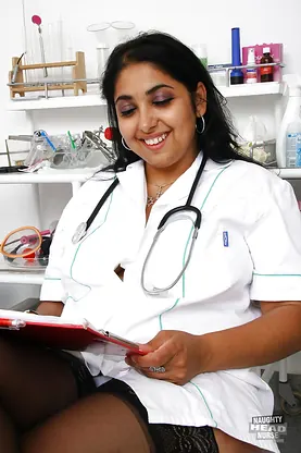 Mature Indian nurse Alice flaunts her big tits & tight lingerie in a hot clinic