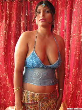 Watch curvy Indian MILF Neha spread her thick Indian pussy and show off her all-natural hooters on the couch