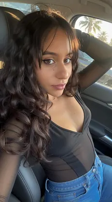 Curly-haired Indian babe Lil' Nadia flaunts her stunning body in sexy shorts