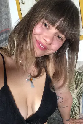 German GF with a stunning smile strips off and flaunts her naked body on the couch