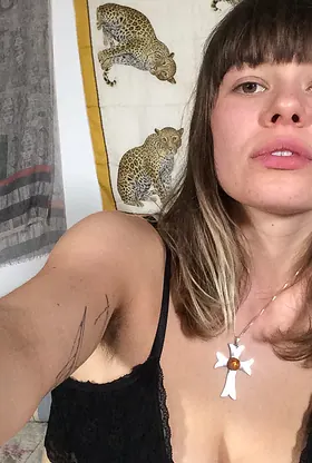 German GF with a stunning smile strips off and flaunts her naked body on the couch