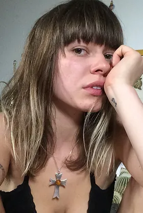 German GF with a stunning smile strips off and flaunts her naked body on the couch