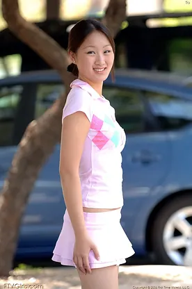 Watch petite Japanese Tia strip down & reveal her perfect tits outdoors