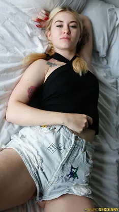 Misha Cross strips and poses in a POV view of her ponytail hair in a short skirt