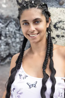 Kinky girl with long hair in braids spreads her pussy and models naked outdoors