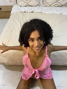 Curly-haired Latina babe Lisandra Official flaunts her swimwear while showing off her big tits and curvy body